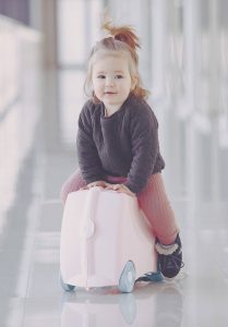 little-girl-with-a-suitcase-at-the-airport-AGWGHQY-scaled.jpg 3